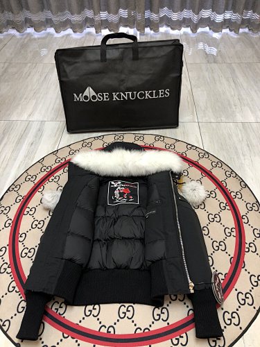 Moose Knuckles Women's Black Hooded Bomber Jacket with Pom-Pom Details