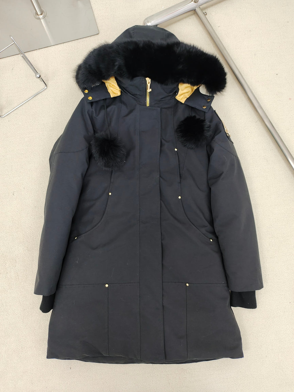Moose Knuckles Women's Long Hooded Parka with Pom-Pom Details