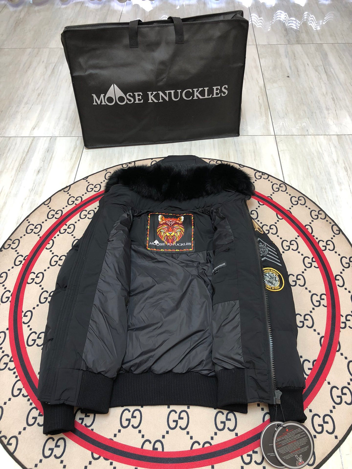 Moose Knuckles Black Hooded Puffer Jacket with Graphic Patches